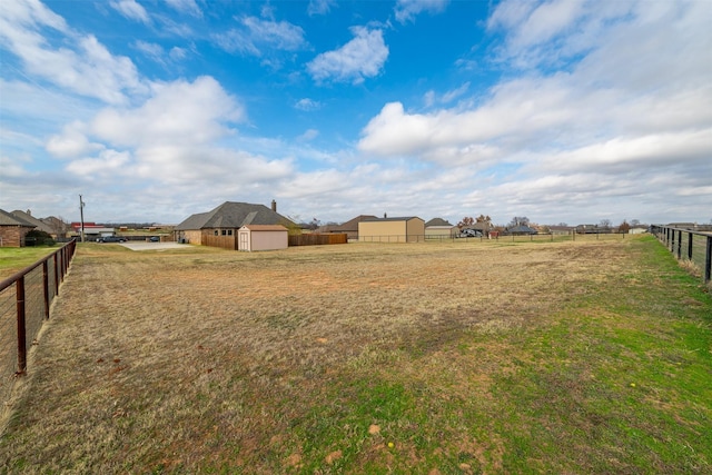 119 Remington Park Dr, Springtown, TX 76082 - view of yard featuring an outdoor structure, a storage unit, and fence