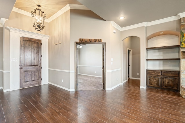 119 Remington Park Dr, Springtown, TX 76082 - unfurnished living room featuring baseboards, wood finished floors, arched walkways, and a chandelier