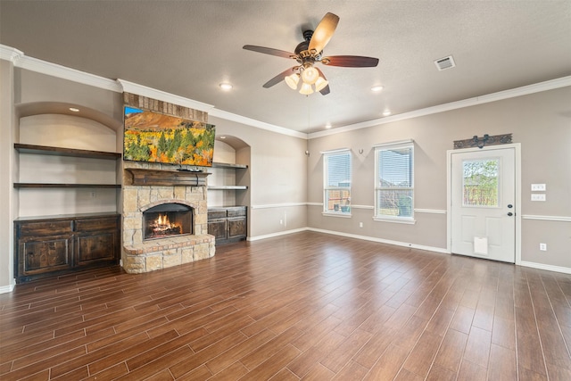 119 Remington Park Dr, Springtown, TX 76082 - unfurnished living room featuring a fireplace, dark wood-style floors, visible vents, and ceiling fan