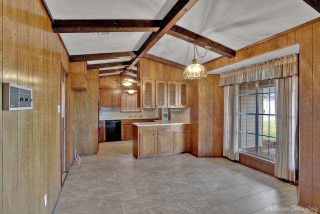 kitchen with decorative light fixtures, lofted ceiling with beams, black dishwasher, and wood walls