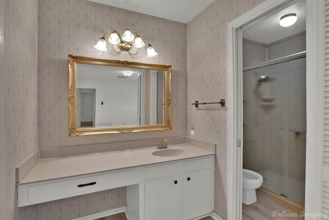 bathroom with walk in shower, vanity, toilet, and wood-type flooring