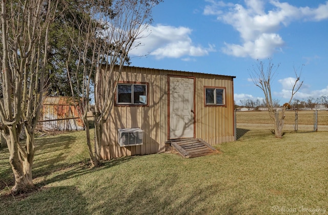 view of outbuilding with a yard