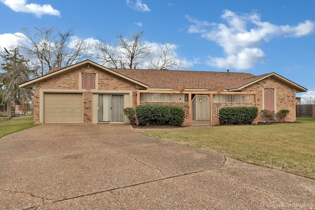 ranch-style home with a garage and a front yard