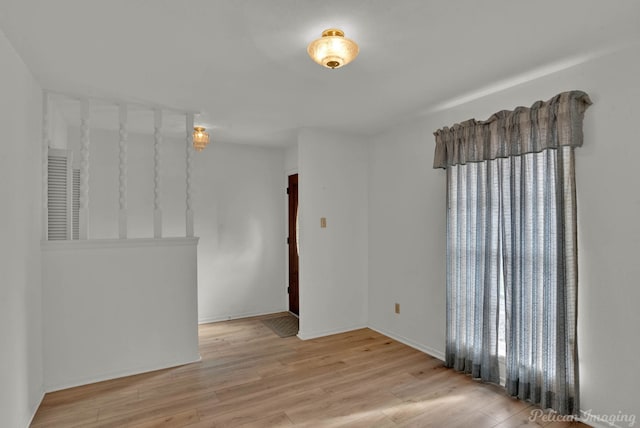 spare room with light wood-type flooring