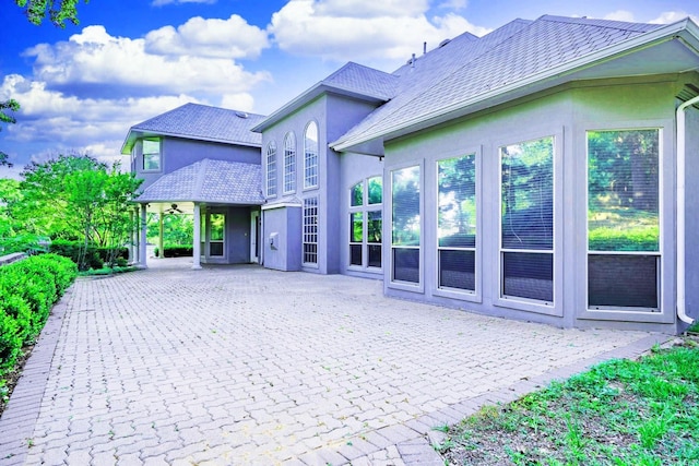 view of side of home featuring a patio