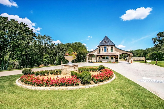 exterior space featuring a porch and a front yard