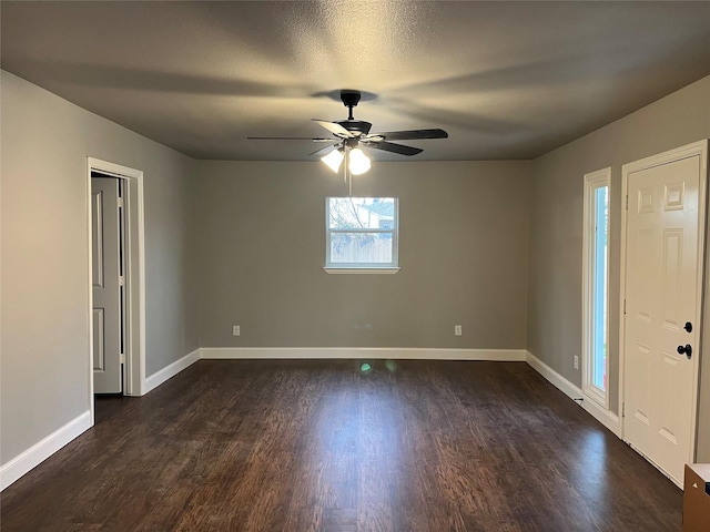 foyer entrance with dark hardwood / wood-style floors and ceiling fan