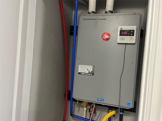 utility room featuring tankless water heater