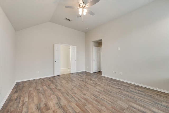 unfurnished bedroom with ceiling fan, light hardwood / wood-style flooring, and lofted ceiling