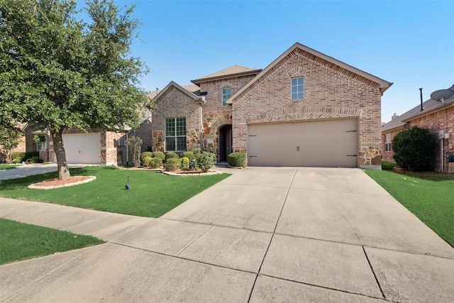 view of front facade with a garage and a front lawn