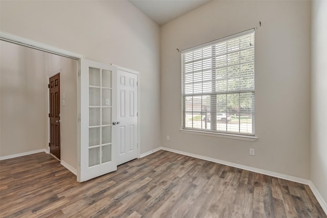 spare room with dark hardwood / wood-style floors