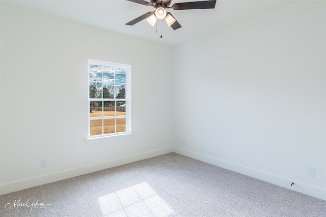 unfurnished room with ceiling fan and carpet floors