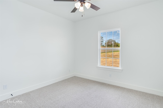 spare room featuring carpet floors and ceiling fan