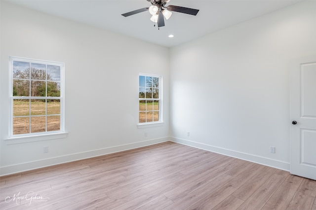 empty room featuring ceiling fan and light wood-type flooring