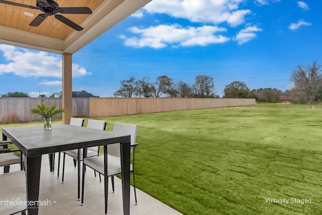 view of yard featuring ceiling fan and a patio area