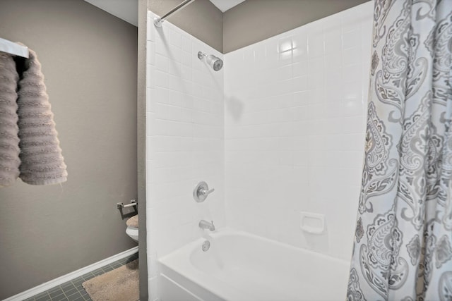 bathroom with tile patterned flooring and shower / bathtub combination with curtain