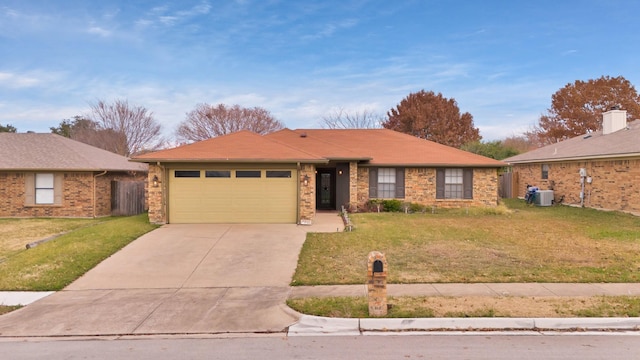 ranch-style house featuring central AC, a front yard, and a garage