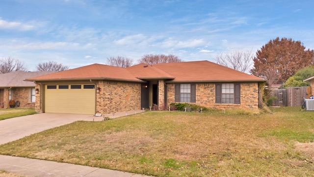 ranch-style home featuring a garage, central air condition unit, and a front yard