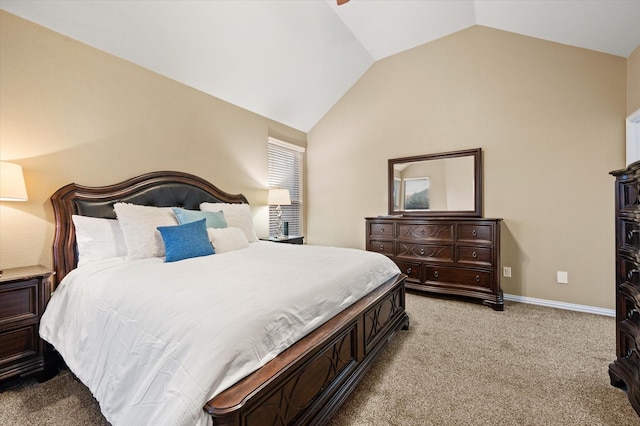 carpeted bedroom with vaulted ceiling