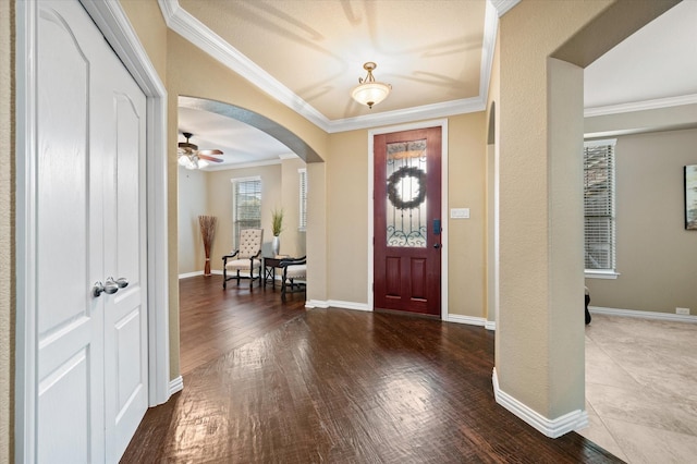 entrance foyer with hardwood / wood-style floors and crown molding