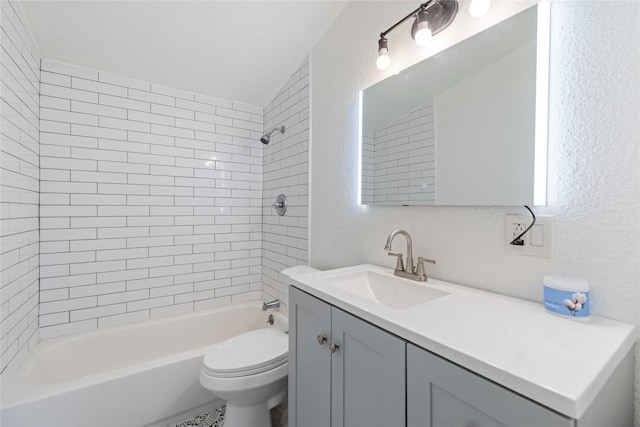 full bathroom with vanity, toilet, and tiled shower / bath