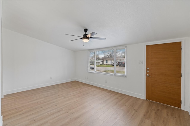 unfurnished room with ceiling fan, light hardwood / wood-style floors, and a textured ceiling