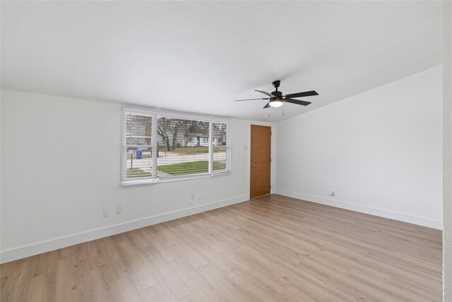 spare room with ceiling fan and light hardwood / wood-style floors