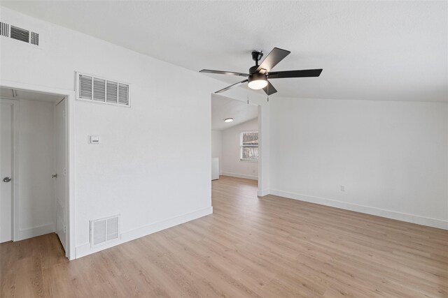 interior space featuring light wood-type flooring, ceiling fan, and lofted ceiling