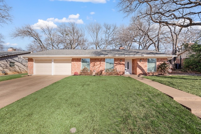 ranch-style house featuring a garage and a front yard