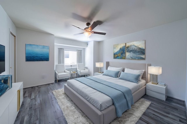 bedroom featuring ceiling fan and dark hardwood / wood-style floors