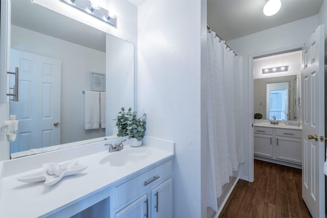 bathroom featuring wood-type flooring and vanity