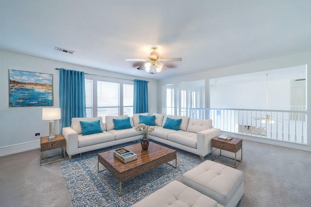 carpeted living room featuring ceiling fan