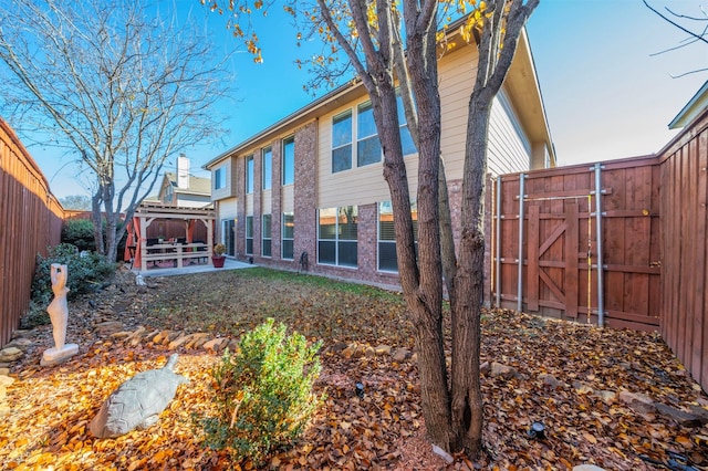 back of house with a patio