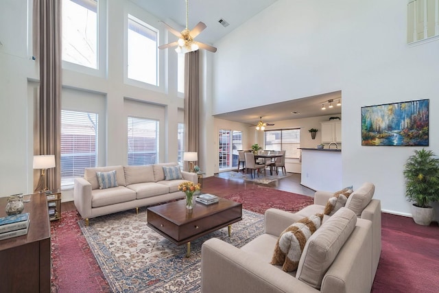 living room featuring a high ceiling