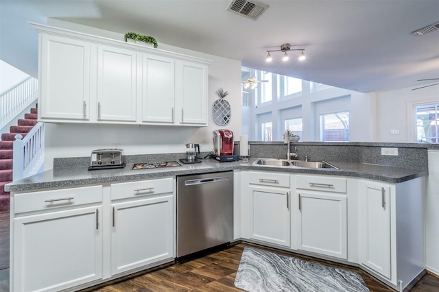 kitchen featuring sink, stainless steel dishwasher, ceiling fan, dark hardwood / wood-style floors, and white cabinetry