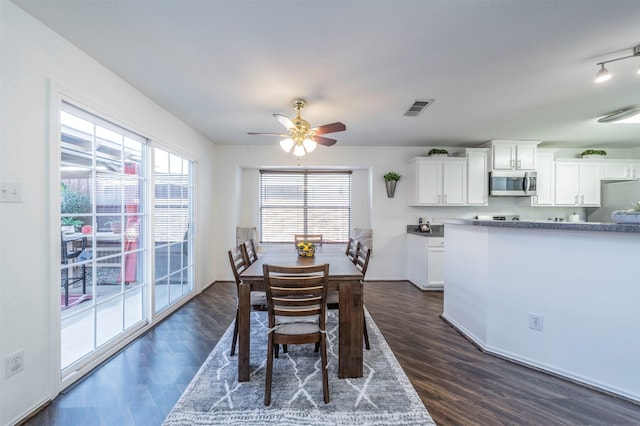 dining room featuring dark hardwood / wood-style floors and ceiling fan