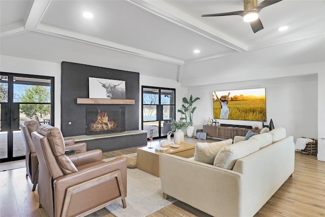 living room with plenty of natural light and light wood-type flooring