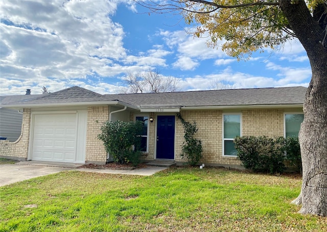 ranch-style home with a garage and a front lawn