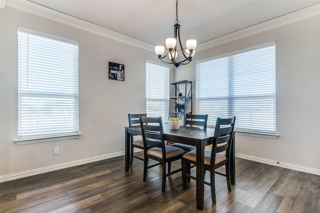 dining space with a healthy amount of sunlight, ornamental molding, dark hardwood / wood-style floors, and a notable chandelier