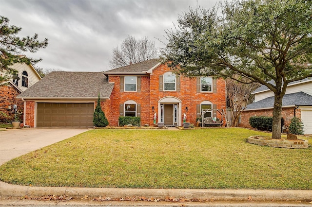 colonial home featuring a front yard and a garage