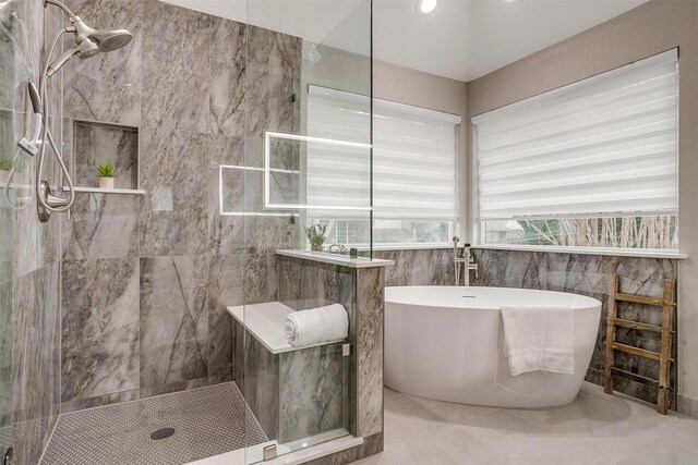 bathroom with separate shower and tub