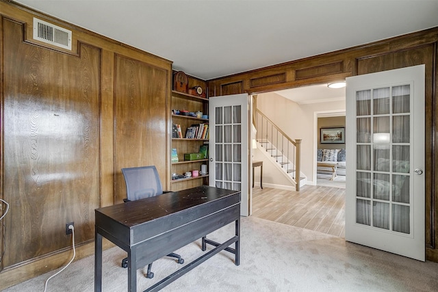 home office with light carpet and french doors