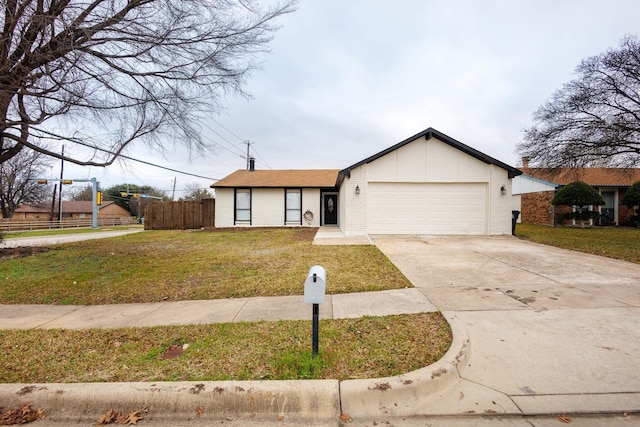 ranch-style home featuring a front yard and a garage