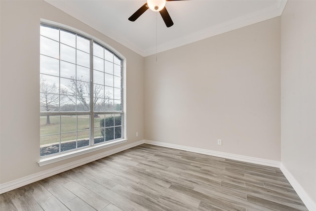 empty room with crown molding, ceiling fan, and light hardwood / wood-style flooring