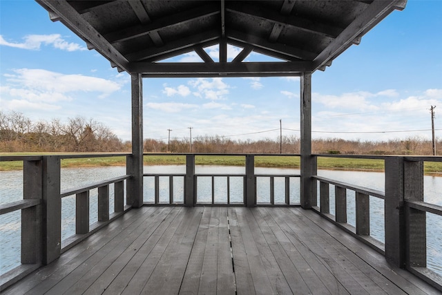 view of dock with a deck with water view