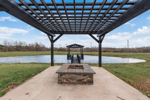 view of patio with a gazebo, a water view, and a fire pit