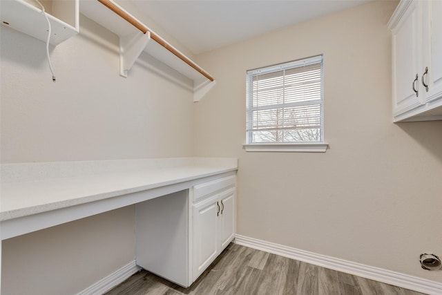 washroom with light hardwood / wood-style floors