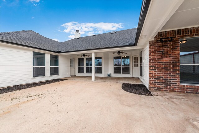 property entrance with ceiling fan and a patio