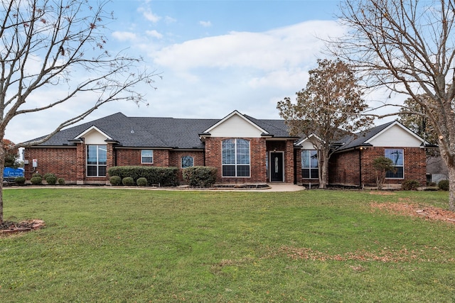 single story home featuring a front lawn