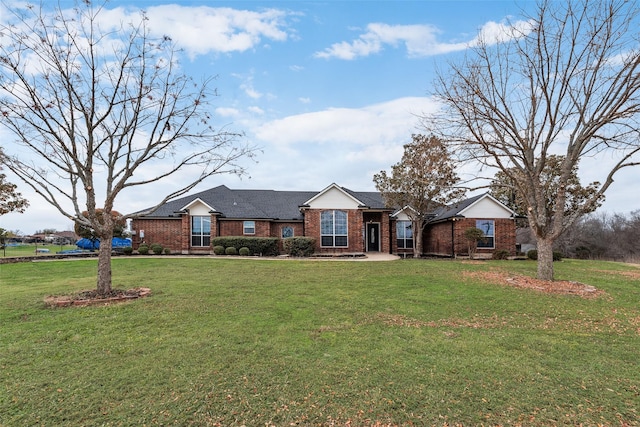 ranch-style home with a front yard